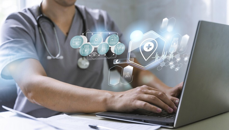 Doctor typing on laptop with medical and healthcare technology icons overlaid on screen.