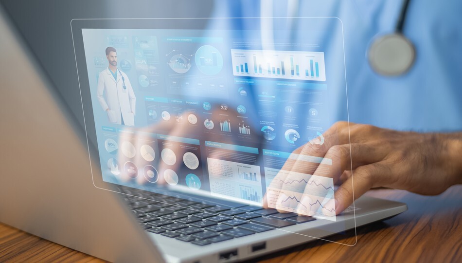 Doctor typing on laptop with holographic patient data dashboards and health analytics overlay.