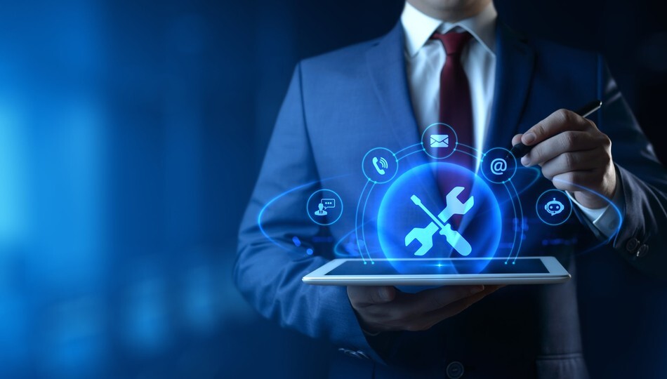 Software maintenance and support shown by a businessman holding a tablet with technical support icons.
