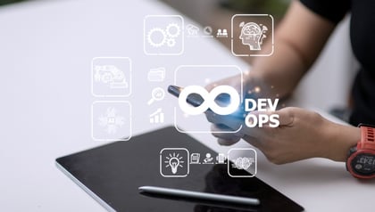 Product development life cycle concept shown through DevOps infinity symbol and tech icons on a screen.