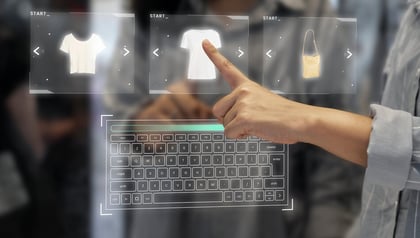 Custom retail software development shown by a hand selecting clothing items on a digital shopping interface.