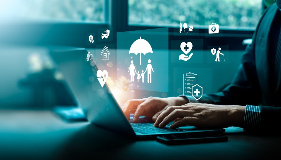 Businessman typing on laptop with insurance icons for family, health, and finance protection overlaid.