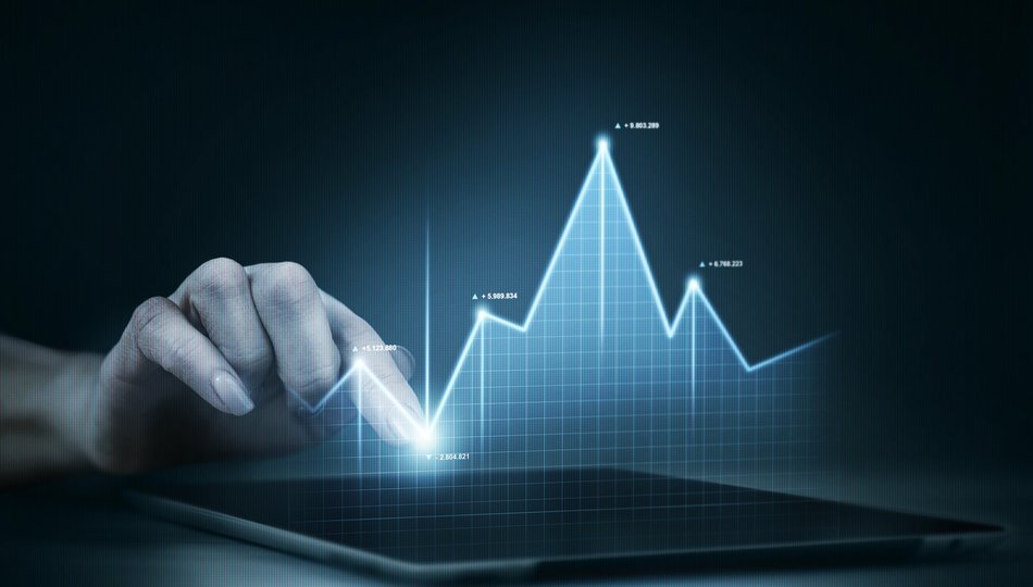 Hand touching a rising holographic financial chart on a tablet, illustrating how to measure AI return on investment.